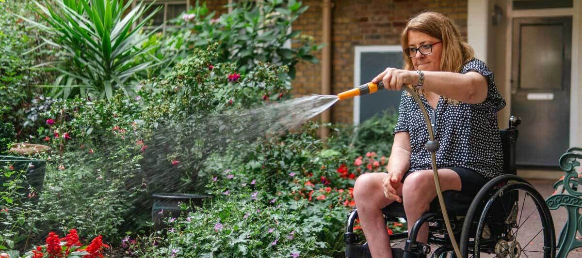 supported independent living - watering the garden