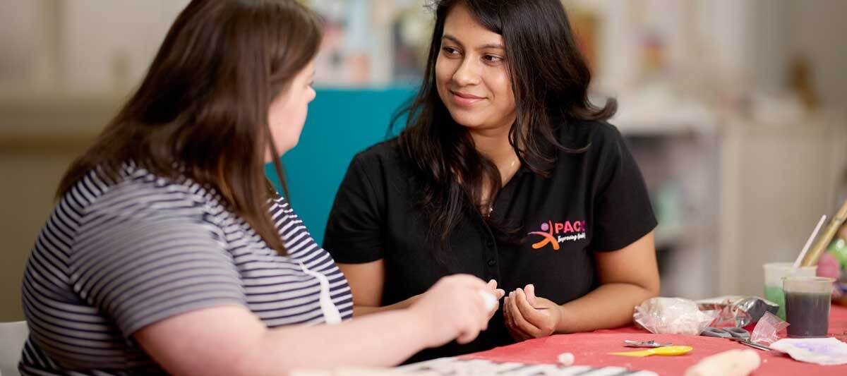 Disability support worker assisting supported independent living.