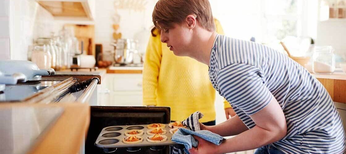 Supported Independent Living Adelaide SIL Providers developing skills like cooking.