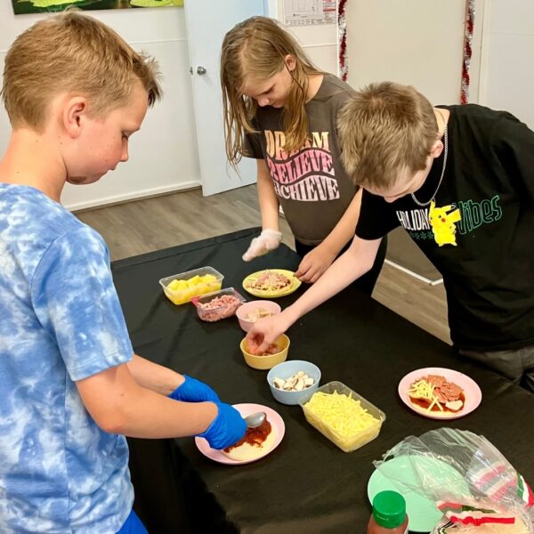 day programs - children cooking pizza